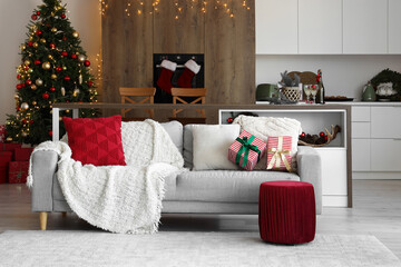 Wall Mural - Interior of light open space kitchen with grey sofa and Christmas decor