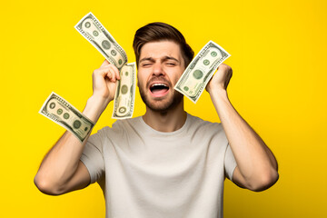 Wall Mural - Young caucasian man taking a lot of money isolated on yellow background frustrated and covering ears