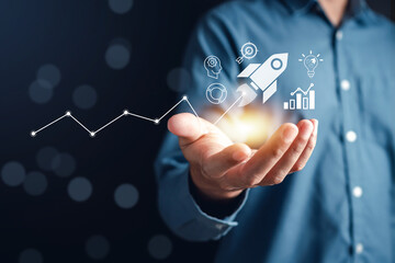 Leinwandbilder - Businessman touch rocket launch investment growth, planning and starting corporate business start up aiming objective value development leadership and customer target group.