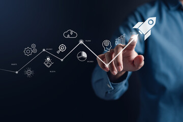 Leinwandbilder - Businessman touch rocket launch investment growth, planning and starting corporate business start up aiming objective value development leadership and customer target group.