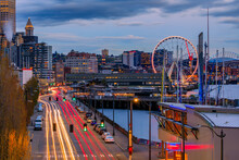 Seattle Waterfront Skyline And The Puget Sound At Sunset In Seattle, Washington