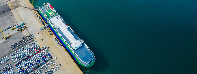 Poster - Aerial view Ro-Ro Ship of business logistic sea freight, New Cars produced by year up in the port for Cargo ship and Cargo import-export around in the world. cargo ship