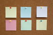 © methaphum - collection of colorful variety post it. paper note reminder sticky notes pin paper blue  on cork bulletin board. empty space for text.