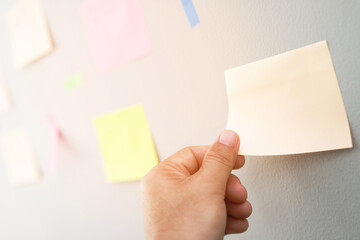 Wall Mural - collection of colorful variety post it. paper note reminder sticky notes pin paper blue  on cork bulletin board. empty space for text.