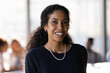 © fizkes - Head shot portrait smiling successful African American businesswoman in office, confident happy young woman entrepreneur employee executive worker looking at camera, posing for corporate photo