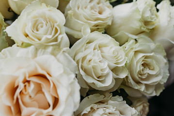  Flower composition of light beige roses, close up.