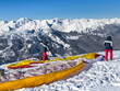  French Alps landscape with unknown paragliders at Courchevel slopes at Les 3 valleys - the world largest ski area. France.