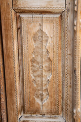 Wall Mural - Close-up photo of a door made from a slightly cracked old log