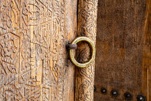 A Beautiful Ring Can Be Seen On The Handle Outside The Beautifully Carved Door