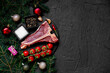 Christmas raw T-bone steak on a background with a fir tree and Christmas toys with copy space for your text
