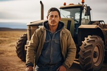 Farmer Man Wearing An Overall Shirt And Standing In Front Of The Tractor 