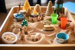 a sand tray with miniatures for sandplay therapy