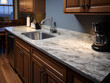 © Aisyaqilumar - Selected focused on kitchen cabinets that use granite as a table top. Granite is cut to cabinet size. Bokeh background.