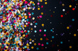 Colorful confetti details from New Years celebration background with empty space for text 