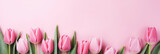 Fototapeta Tulipany - BOUQUET OF FRESH TULIPS ON A LIGHT PINK BACKGROUND. TOP VIEW WITH EMPTY SPACE AND COPY SPACE. AI generated