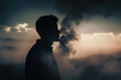 Silhouette of a man with smoke vapour 