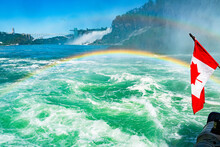 Huge Rainbow And Canadian Flag, View Of Bridal Veil Falls, Niagara Falls, Part Of Goat Island, Ontario, Canada. High Quality Photo