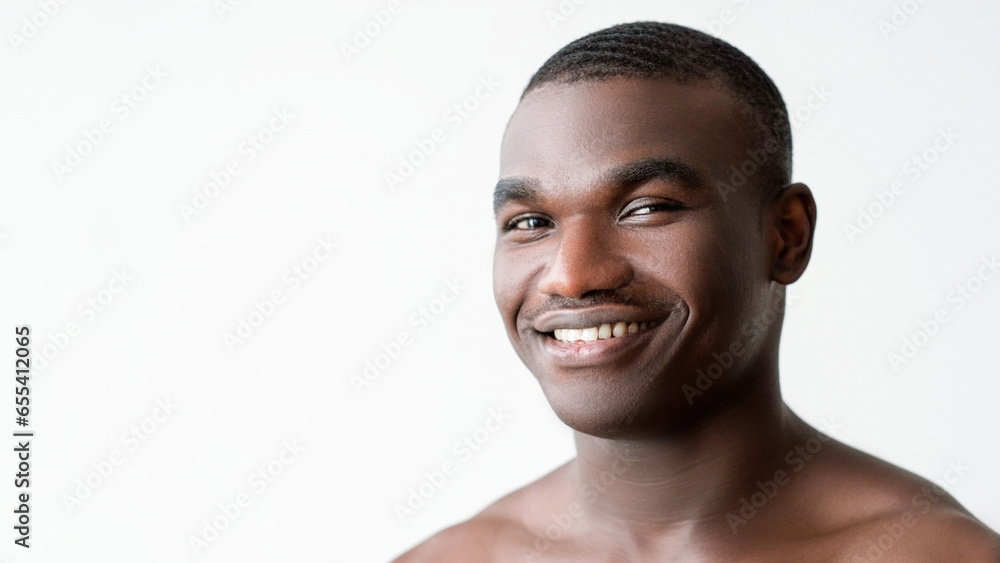 Man skincare. Hygiene treatment. Happy handsome shirtless guy with soft ...