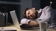 © Anna - Tired businessman sleeping on laptop at night in office late at night