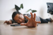 © Gatot - Man falling and lying on the floor asking for help
