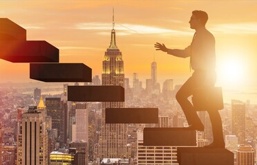 Businessman in career promotion concept with stairs