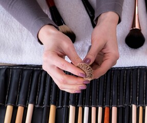 Wall Mural - Make-up artist preparing brushes for work