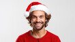 Portrait of smiling man in Santa hat isolated on white background. Merry Christmas and Happy New Year.