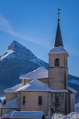 Wall Mural - View on the church of Saint Pierre de Chartreuse and the Chamechaude peak covered in snow in the French Alps
