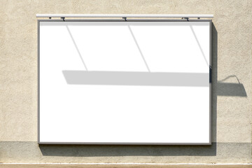 Wall Mural - Billboard mockup. Blank advertising poster in frame mounted on building exterior wall with shadow effect