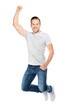 © Photocreo Bednarek - Casual young man jumping in winning power gesture isolated and cut out on transparent white background