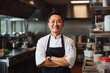 © VisualProduction - Portrait of asian chef smiling in kitchen while preparing his course menu meal for restaurant opening, successful asian chef cooking for top restaurants