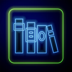 Sticker - Glowing neon Book icon isolated on blue background. Vector