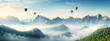 hot air balloons fly in the sky over mountain landscape