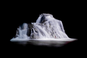 Wall Mural - Real photo of a beautiful waterfall on a black background for your project.