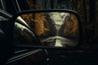 The reflection of a road in a car's side mirror with a dark sky and trees in the background. Generative AI