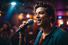 Beautiful Young Man Singing Into A Microphone In A Nightclub. Karaoke Singer. Music Concept.