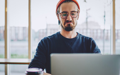 Wall Mural -  hipster guy watching online video