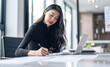 © Charlie's - Beautiful confident asian business woman working with laptop Hands typing  keyboard. Professional investor working new start up project. business planning in office. Technology business