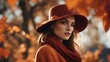 © vanAmsen - portrait of a woman in a hat  in autumnal fashion, rich oranges and deep