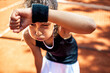 Young girl is exhausted after a tennis training on a clay court