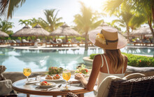 A Beautiful Woman On Breakfast Near Swimming Pool In Luxurious Tropical Resort.