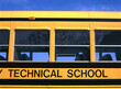 Side view of a yellow school bus for a technical school