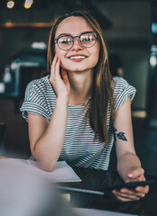 Wall Mural - Casual pretty student in cafe