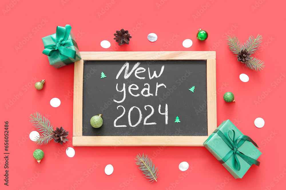 Blackboard with text NEW YEAR 2024 and Christmas decorations on red background