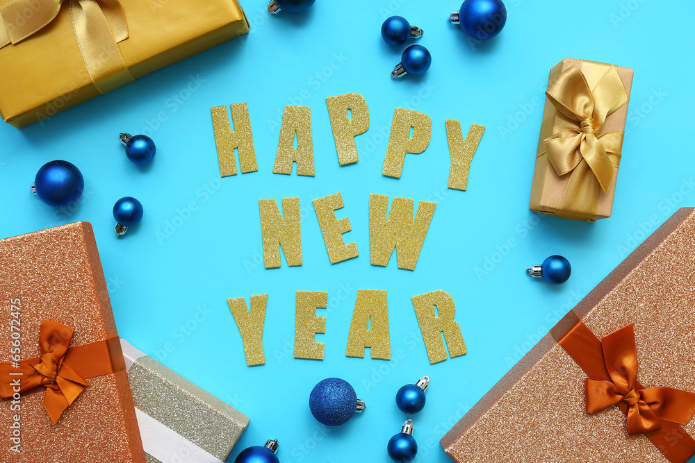 Text HAPPY NEW YEAR with Christmas balls and gift boxes on blue background