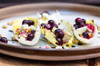 Belgium endive boats with huckleberries, nuts and cheese