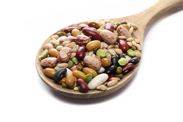 Wall Mural - Mix legumes and cereals in wooden spoon, (beans, peas, lentils, barley, spelt) isolated on white, side view