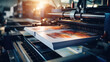 © dinastya - Close-up of a press printing machine in operation of printing in color. Printing house, publishing industry.