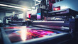 © dinastya - Close-up of a press printing machine in operation of printing in color. Printing house, publishing industry.
