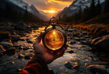 Fototapeta Sport - Man holds in hand fantasy compass, magic artifact on background of science-fiction world with sunset, river with stones, mountains and wood